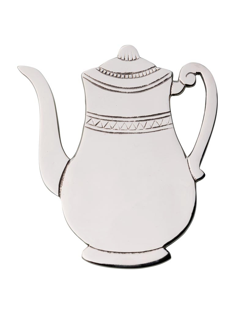 Cream ceramic teapot trivet with geometric band pattern detail, decorative kitchen hot pad serving piece.