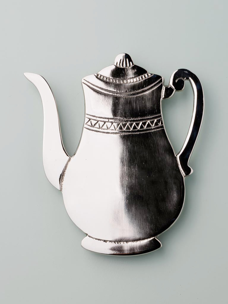 Black and white ceramic teapot trivet with ornamental trim detail, decorative kitchen hot pad tableware.