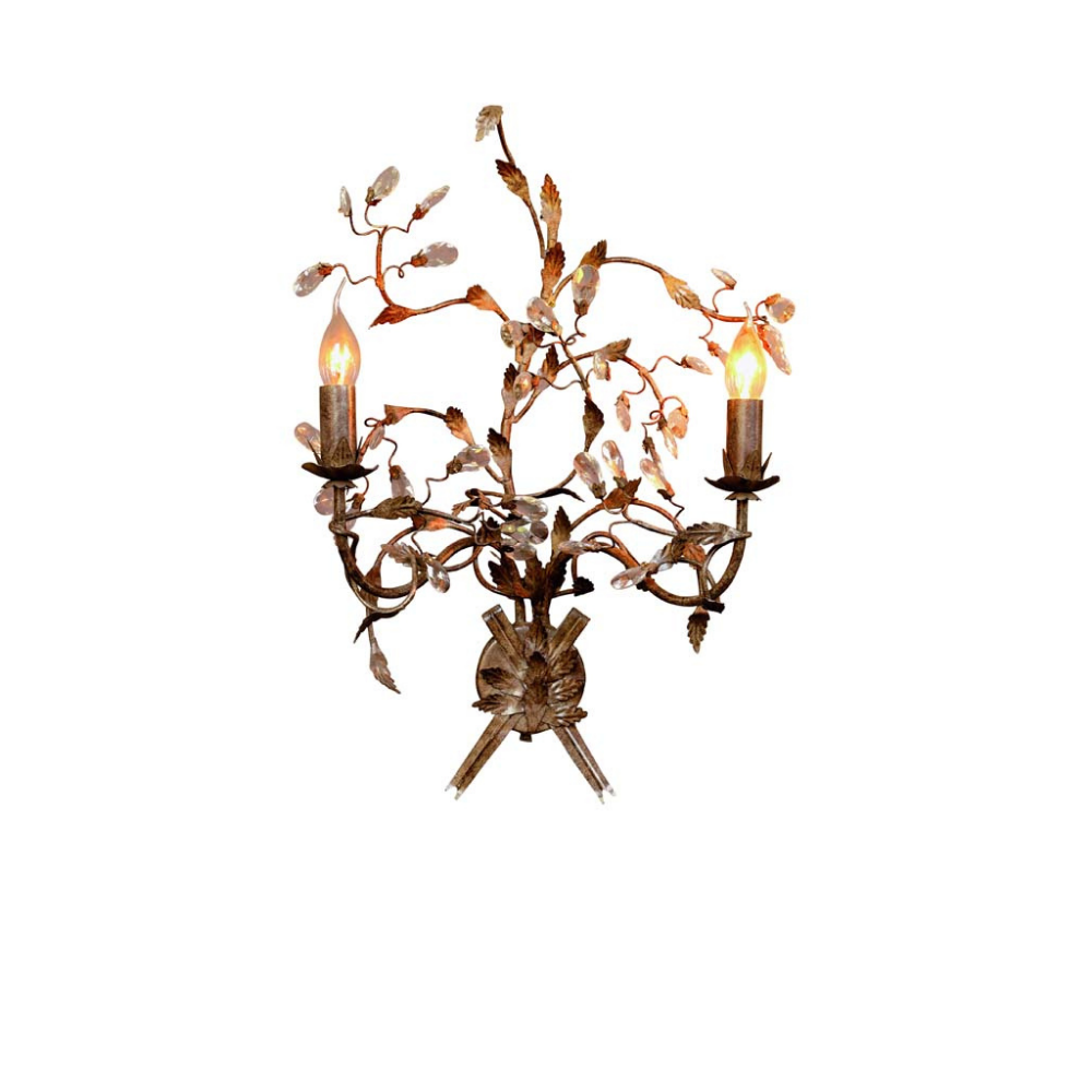 A decorative metal wall sconce with a rustic branch and leaf design, featuring two lit candle-style bulbs, photographed against a plain white background.