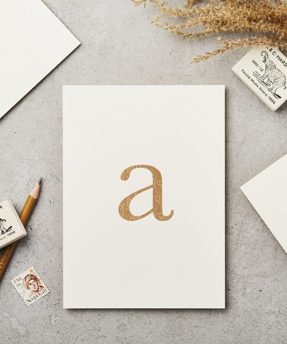 Lowercase Initial Postcard (A) - minimalist white notepad glittery gold
