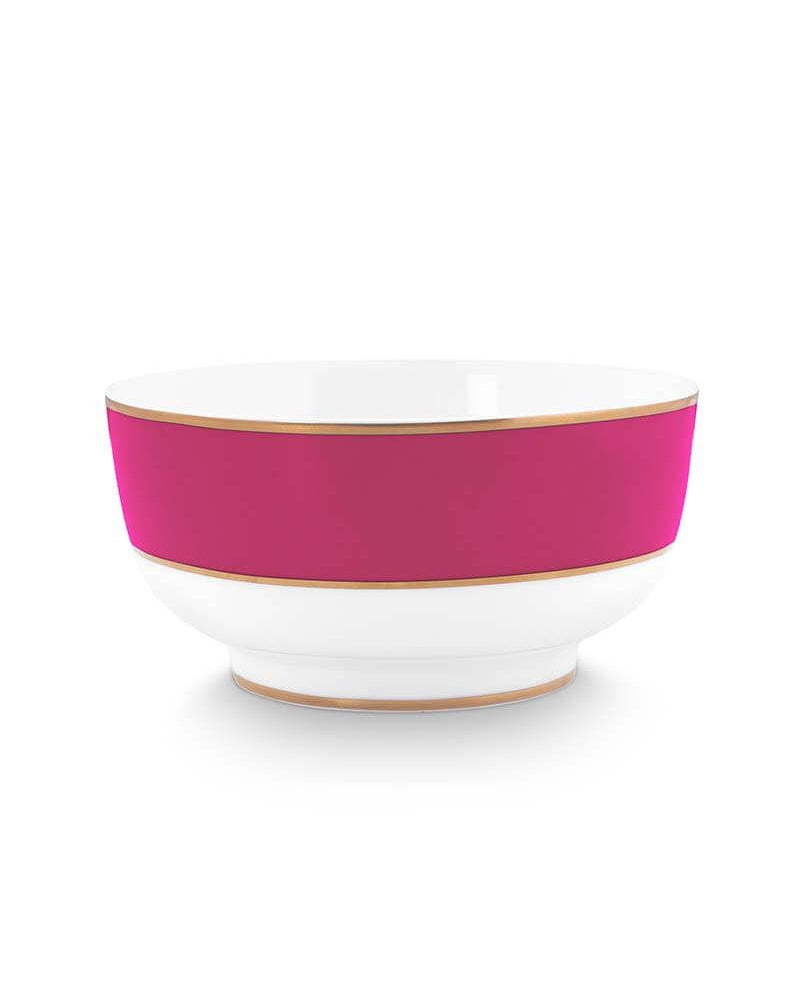 A white ceramic bowl featuring a wide magenta pink band around the middle and thin gold trim along the rim and base, set against a plain white background.