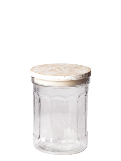 A clear glass jar with a light beige wooden lid, shown against a plain white background.