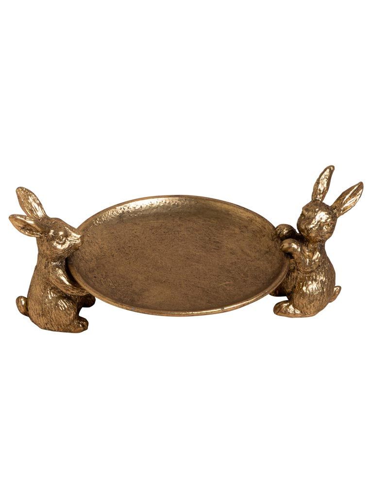 A decorative oval tray with two small rabbit figurines holding its ends, shown on a plain white background.