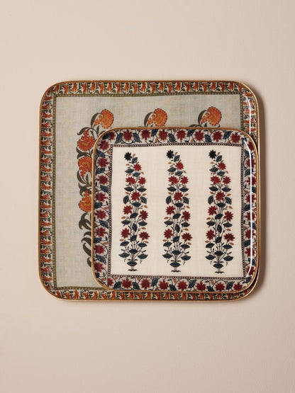 Decorative tray with floral patterns on a beige background.