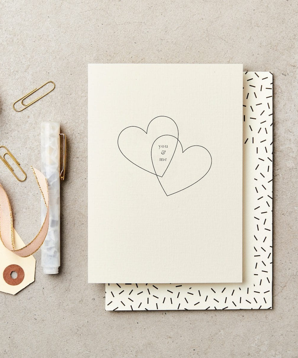You And Me Hearts - cream-colored card two black-outlined hearts