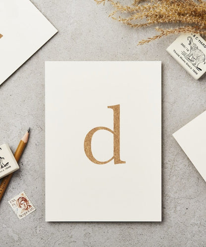 Lowercase Initial Postcard (D) - minimalist white notepad gold foil